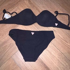 5 bathing suits and 2 cover ups. Size M top and L bottom.